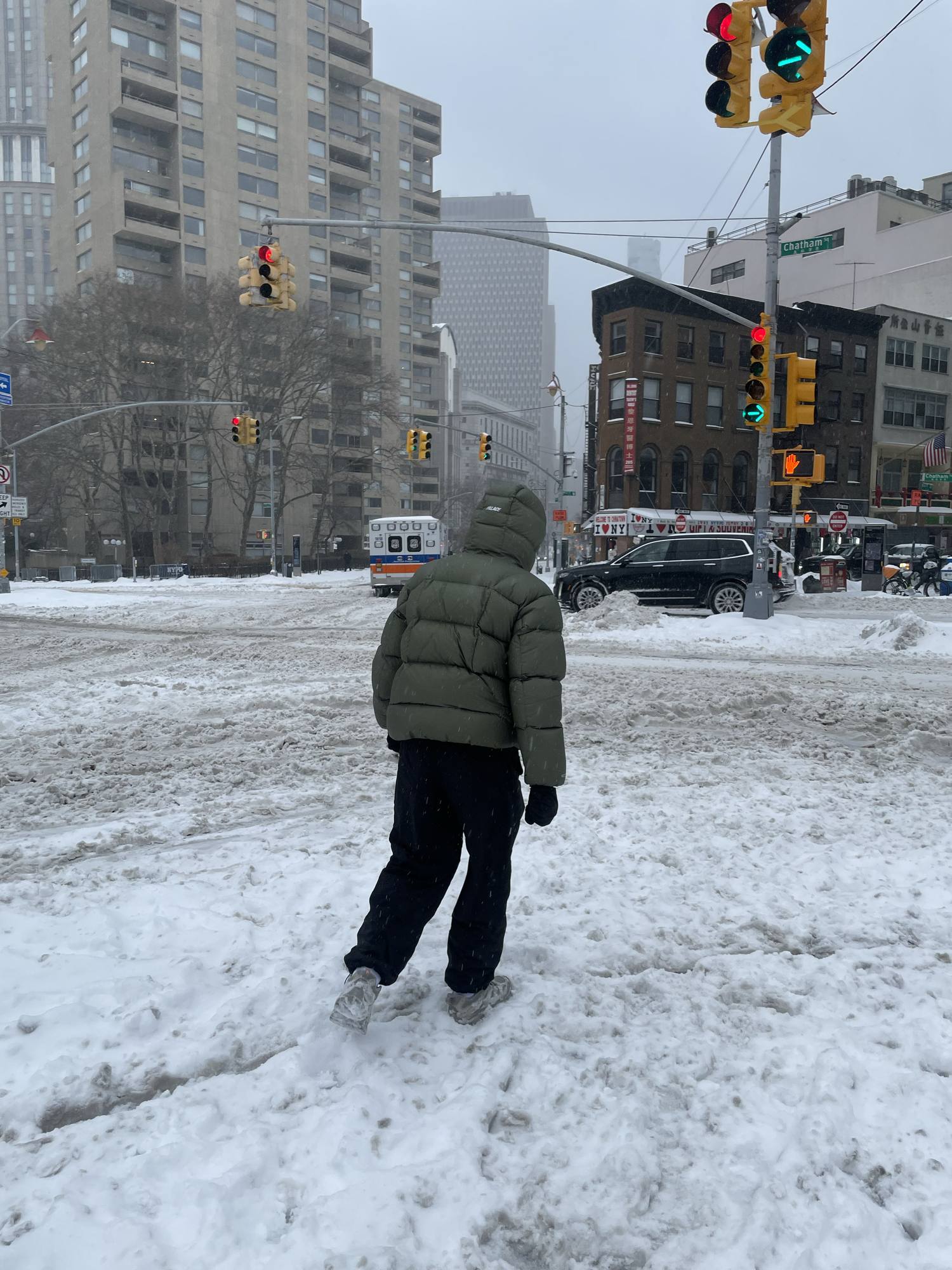 Rudolf Kurzanov walking through snow in Lower Manhattan